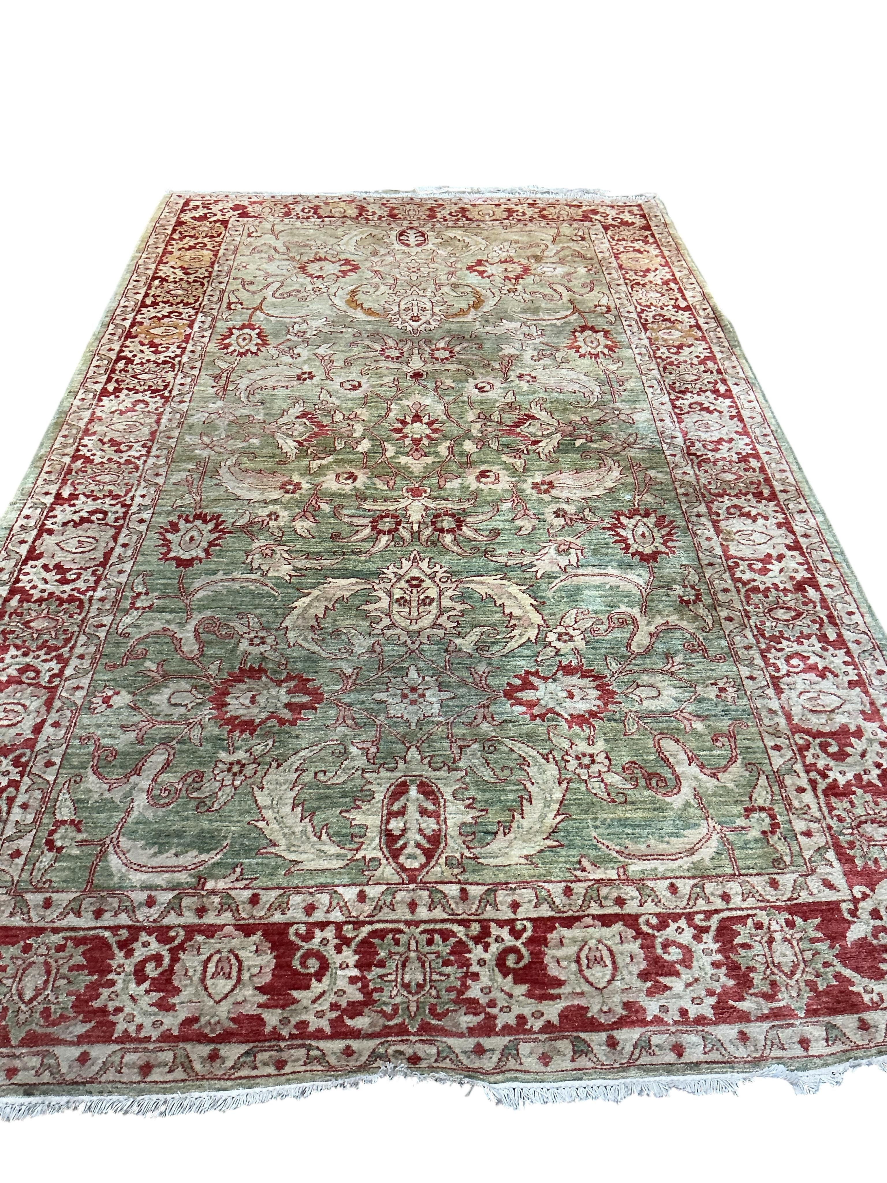 A Zeigler style pale green ground carpet, 340 x 204cm